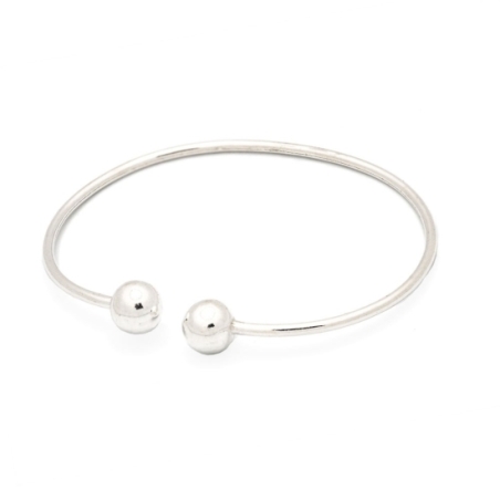 Pulsera de plata con un diseño clásico pero actual , abierto para poder adaptar a cualquier muñeca, rematada en dos bolas de 8/9