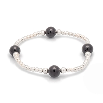 Pulsera de bolitas de Plata de Ley de 3 y 4mm enfiladas en hilo de silicona con 4 bolas de 8mm de Ónice que componen una pieza m