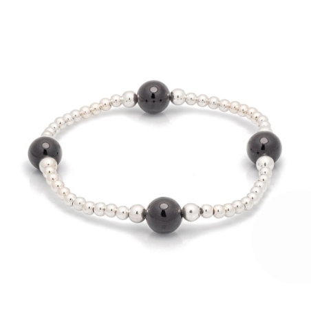 Pulsera de bolitas de Plata de Ley de 3 y 4mm enfiladas en hilo de silicona con 4 bolas de 8mm de Ónice que componen una pieza m