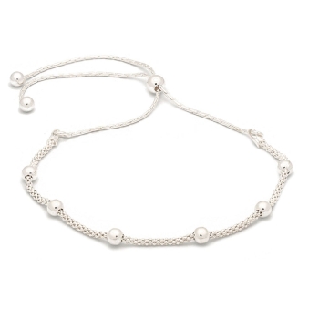 Pulsera de plata de una vuelta con 6 bolitas ensartadas en un cordón de plata, original cierre corredizo que permite adaptar la 
