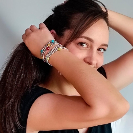 Pulsera de bolitas de Plata de Ley de 3 y 4mm enfiladas en hilo de silicona con 4 bolas de 8mm de Ónice que componen una pieza m