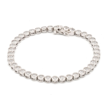 Pulsera de Plata de Ley rodiada con circonitas de 4,5mmØ engastadas en chatón, con un largo tota de 18cm y rematada con uñeta y