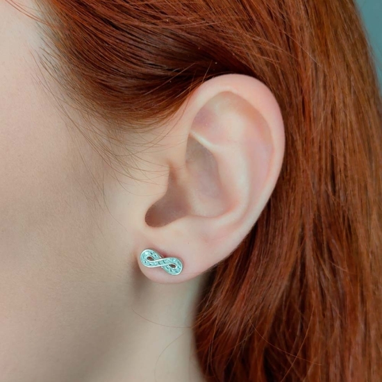 Pendientes de Plata de Ley rodiada, con un armonioso símbolo de infinito formado por circonitas blancas engastadas en carril, ca