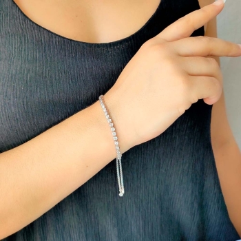 Pulsera de Plata de Ley rodiada con circonitas de 4,5mmØ engastadas en chatón, con un largo de 13cm de tramo de chatones más 2 t 2